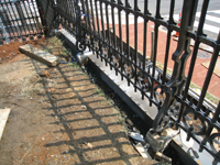 Fence--Stones set between fence bases - June 10, 2011