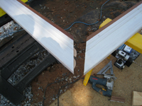 Carriage House--Detail of clear African Mahogany for addition--primed for outside, stained for inside, showing joint - July 9, 2011