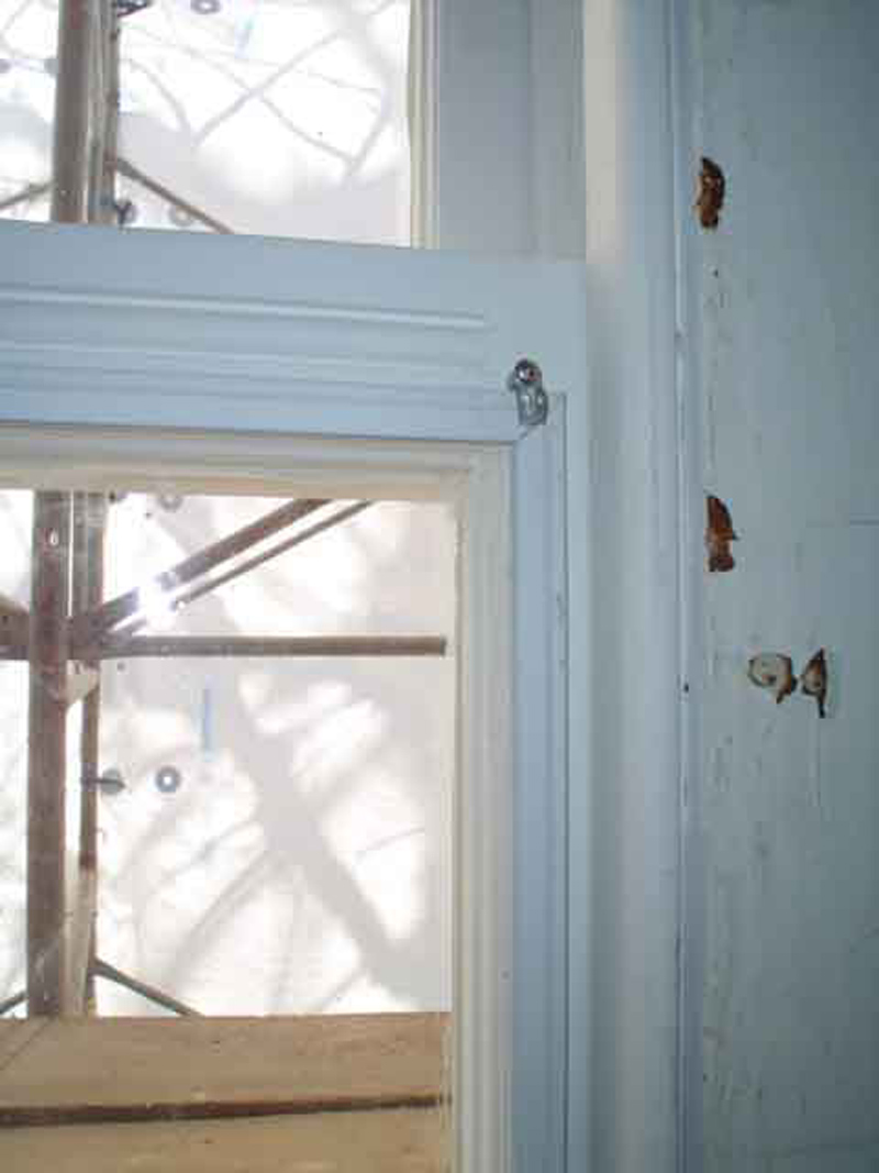 The interior storm windows are being added to the bottom window sashes for insulating 
purposes. These plexiglass additions are practically not noticeable to the casual observer, 
even at a close distance.