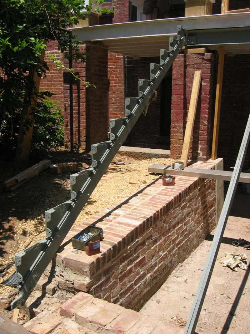 Reassembly of the stairs started with the frame for the stairs on each side and the centers. 
This was a complex job since there was much fitting to be done given the long time these pieces 
had been together and the minute changes in fitting that had taken place.