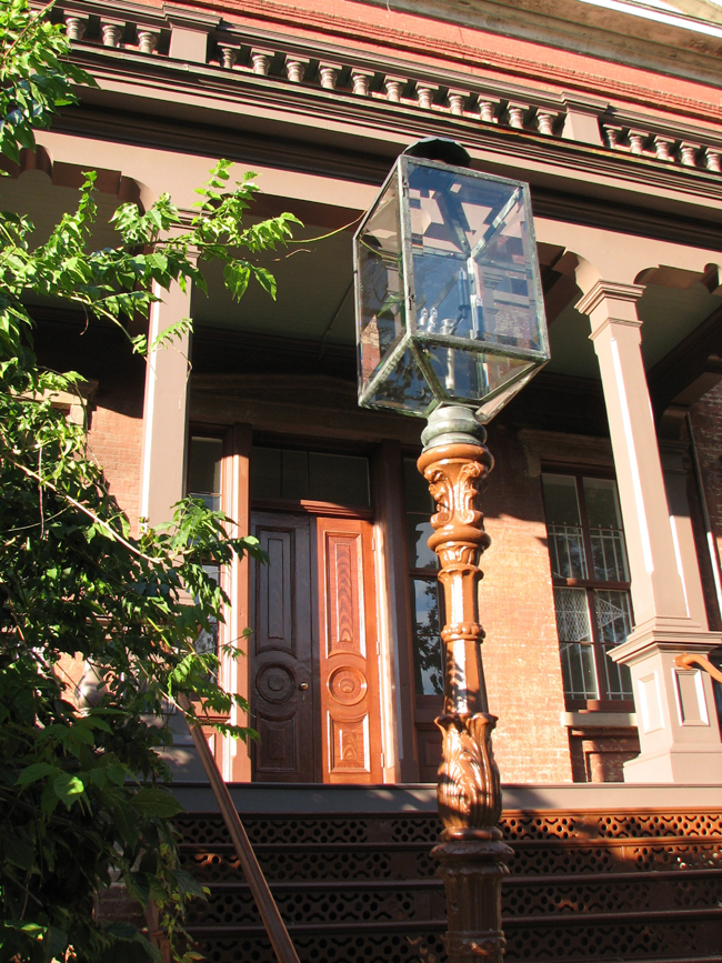 The juxtaposition of the light fixture, the standard, the restored stairway and portico, 
give us a taste of what the Old Naval Hospital will look like when the full restoration is 
completed.